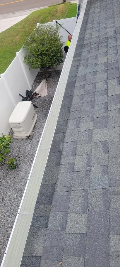 Gutter guard installed along a Florida roofline