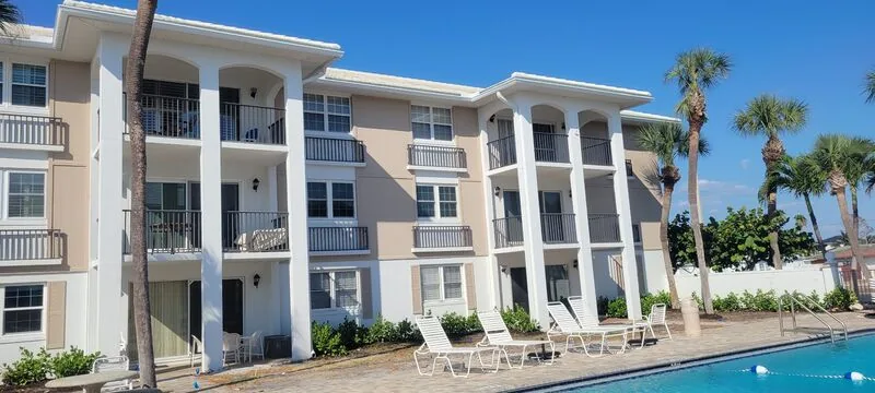 Florida condo building with pool deck and lanais