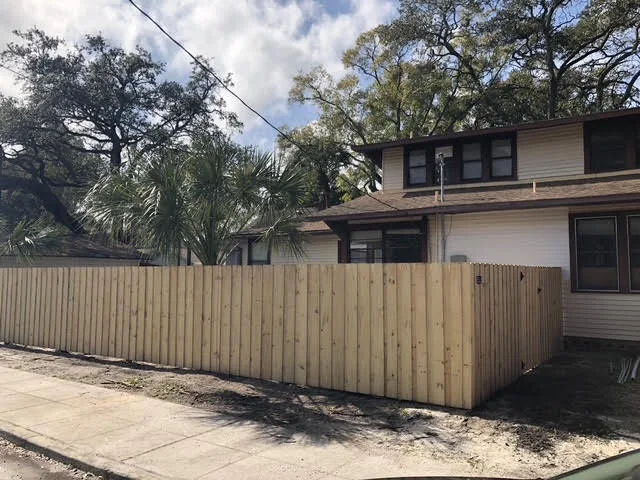 Wood privacy fence installed along a residential property line