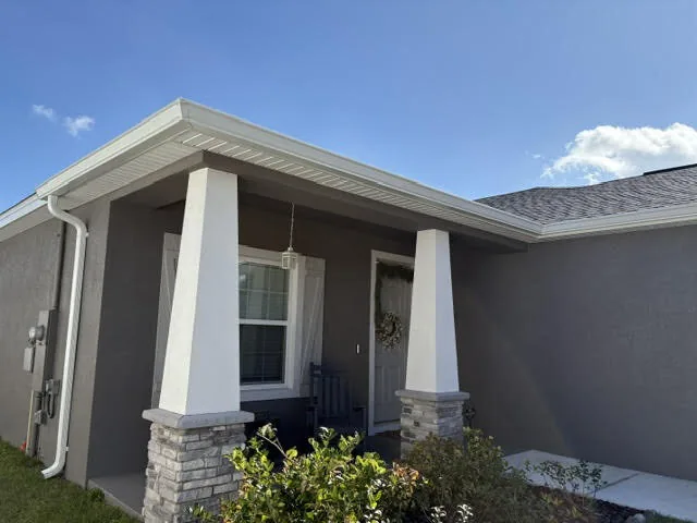 White 6-inch K-style seamless gutters on a residential home