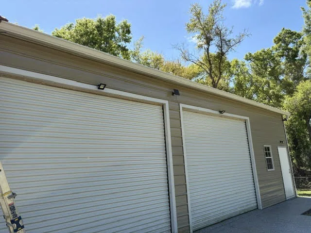 Large 8-inch commercial gutter installed on a warehouse building