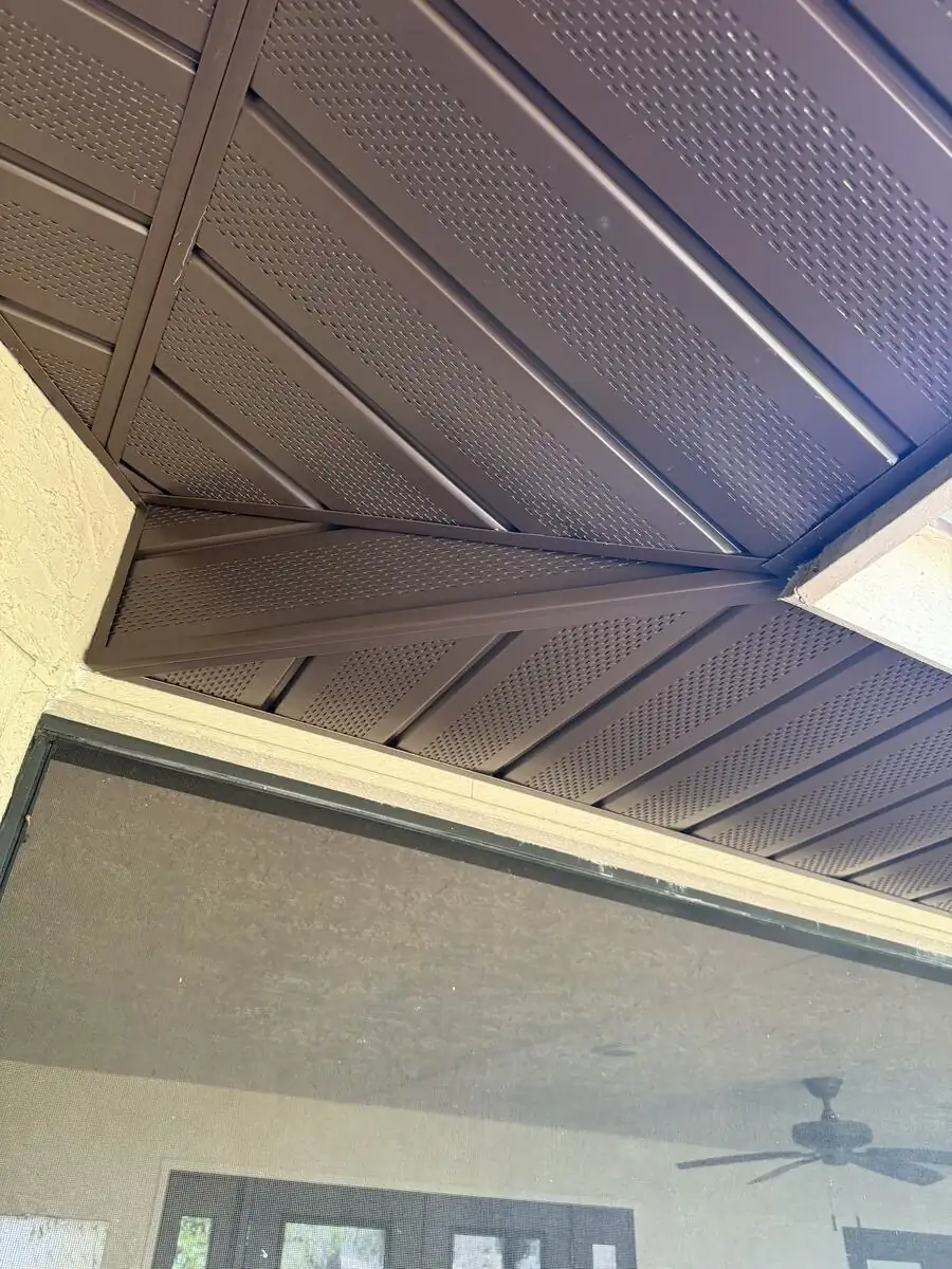 Finished brown soffit corner with diamond panel pattern