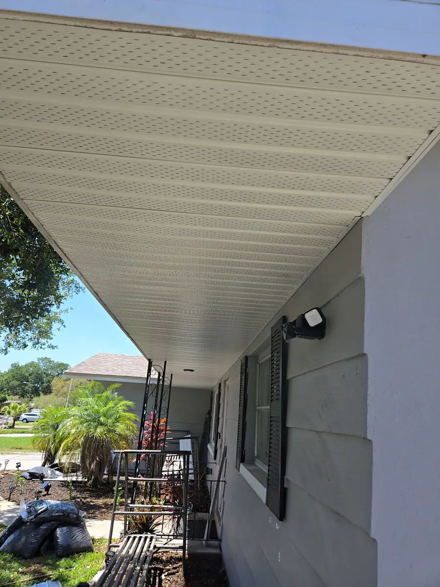New white vented soffit installed along a full eave run